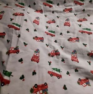 Twin flat sheet trucks carrying tree holly berry